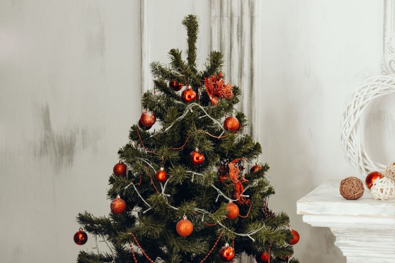 62. Making Your Home Sparkle this Holiday Season with a Festive Artificial Christmas Tree and Accessorizing It with the Right Ornaments and Skirts